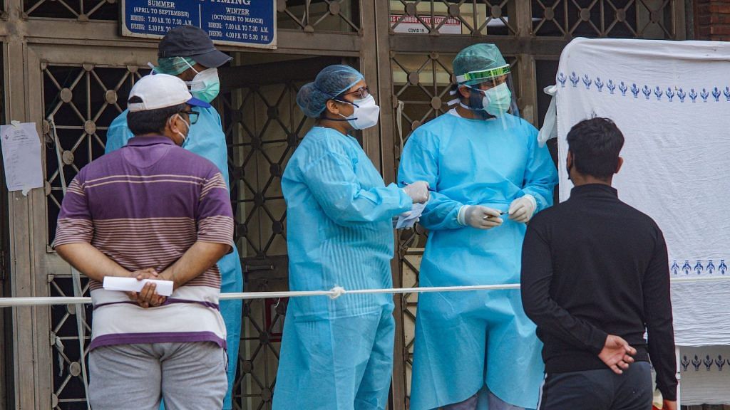 Medics attend to patients at a government hospital, during the ongoing COVID-19 nationwide lockdown in New Delhi | PTI
