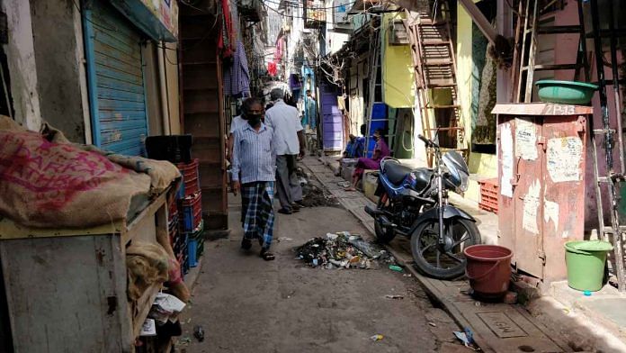 Muck extracted from drains lines a congested Dharavi lane | Swagata Yadavar | ThePrint
