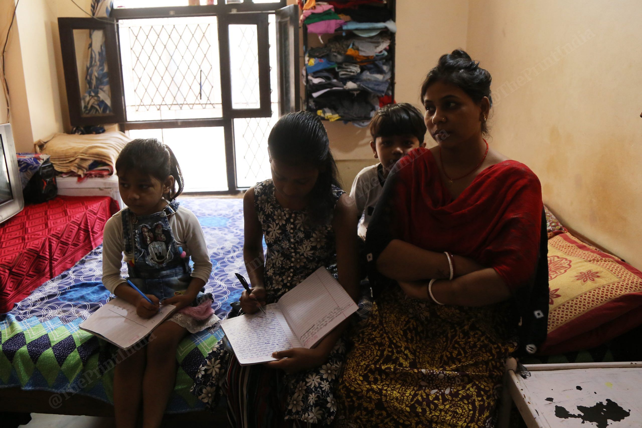 Kiran Debi and her children who attend government schools in Delhi. | Photo: Manisha Mondal/ThePrint 