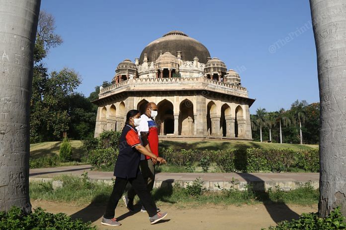 Delhi residents out for a walk in Lodhi Garden wearing masks to protect against Covid-19 | Photo: Suraj Singh Bisht | ThePrint