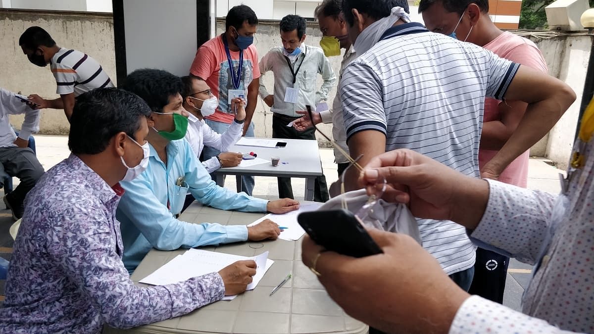 Members of Surat Diamond Association collecting details of workers to send them back home. | Photo: Soniya Agrawal/ThePrint