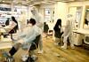 Salon employees wear PPE kits to attend to customers | Photo: ANI