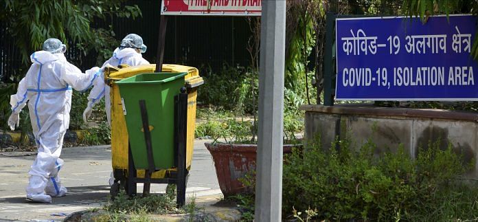 Representational image. Workers in protective suits dispose Covid-19 bio-medical waste outside a hospital, during the ongoing nationwide lockdown to curb the spread of coronavirus, in New Delhi. | PTI