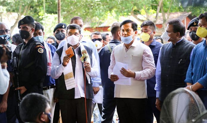 Union Petroleum Minister Dharmendra Pradhan (left) and Assam Chief Minister Sarbananda Sonowal (right) take stock of measures taken by experts to douse fire at Baghjan gas well site, in Tinsukia District, Sunday, June 14, 2020. | PTI