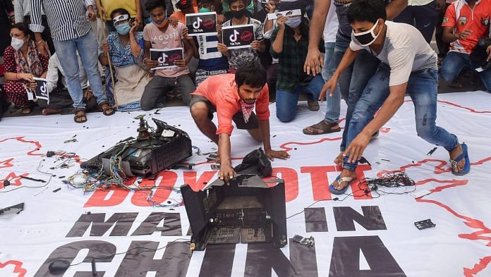 Youth Congress activists in Kolkata smash Chinese products during a protest over the killing of 20 Indian Army soldiers in Ladakh's Galwan Valley. | PTI
