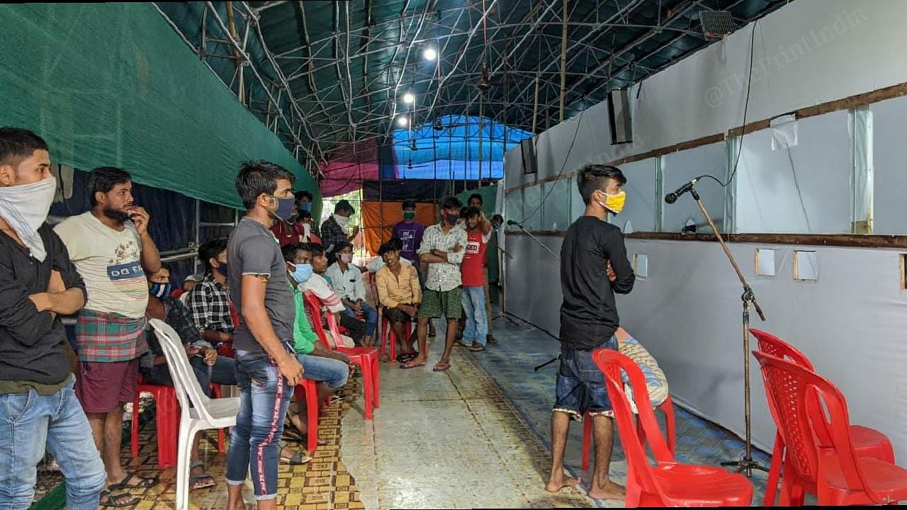 Migrant returnees from Tamil Nadu, Karnataka and Kerala, wait for their turn at the swab collection facility that has been setup close to the Assam-West Bengal border. | Photo: Yimkumla Longkumer | ThePrint