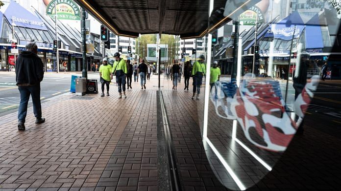Pedestrians walk along a sidewalk during a staged exit from a lockdown caused by the coronavirus in Wellington, New Zealand | Photographer: Birgit Krippner | Bloomberg