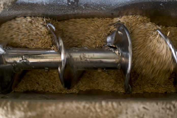 A corkscrew turns as a machine processes rice grains in a Compagnie Agricole de Saint-Louis du Senegal (CASL) rice processing and storage facility | Photographer: Xaume Olleros | Bloomberg file