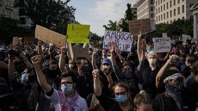 Demonstrators gather at Lafayette Park for protest against police brutality and the death of George Floyd | Photographer: Drew Angerer | Getty Images North America via Bloomberg