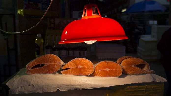 A light illuminates salmon for sale at a store (Representational Image) | Photographer:Brent Lewin | Bloomberg