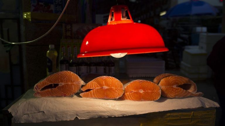 There’s low risk of food spreading the virus, experts say after salmon panic