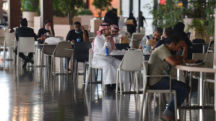 People sit at a cafe in a mall in the Saudi capital Riyadh on June 4, 2020, after it reopened following the easing of some restrictions put in place by the authorities | Photographer: Fayez Nureldine | AFP/Getty Images via Bloomberg