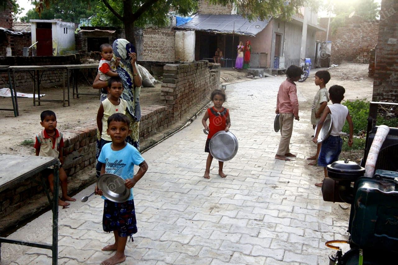 Everybody came rushing out of their homes in Baghai village to see the locusts swarming over their homes and farmlands. With them also came out young children banging utensils to scare the migratory pests away | Praveen Jain | ThePrint