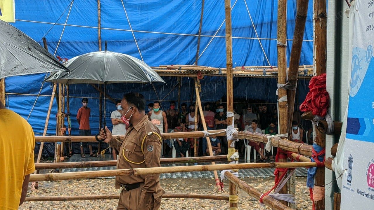 A policeman guards the quarantine facility near the Assam-West Bengal border at Chagolia gate. | Photo: Yimkumla Longkumer | ThePrint