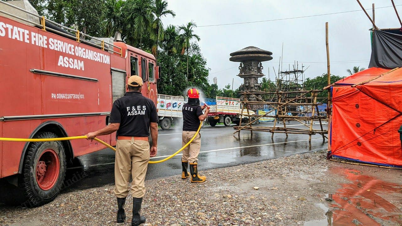 The State Fire Service Organisation Assam routinely sanitise the screening area at the Chagolia interstate border gate. | Photo: Yimkumla Longkumer | ThePrint