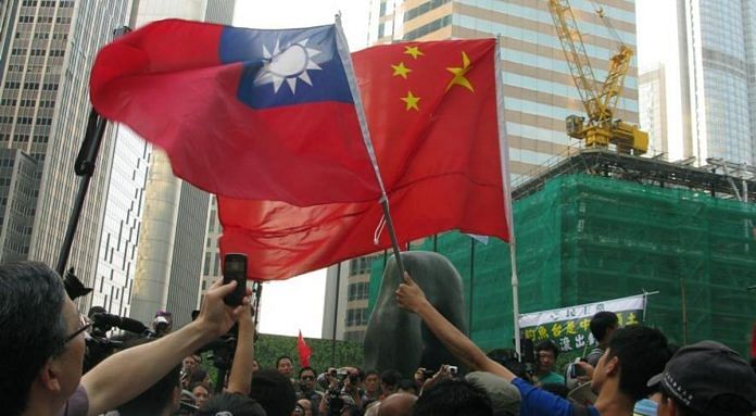 People holds up flags of China and Taiwan at Hong Kong. China views Taiwan as an inalienable part of its territory that must be brought back under Beijing’s control | Twitter