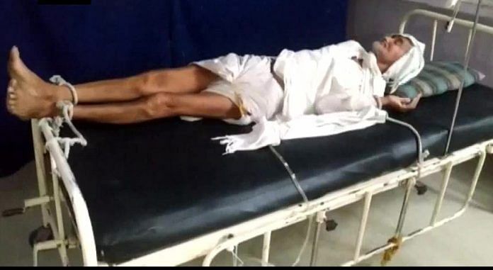 80-year-old Laxmi Narayan tied to the bed in Shajapur City Hospital in Madhya Pradesh | Photo: ANI