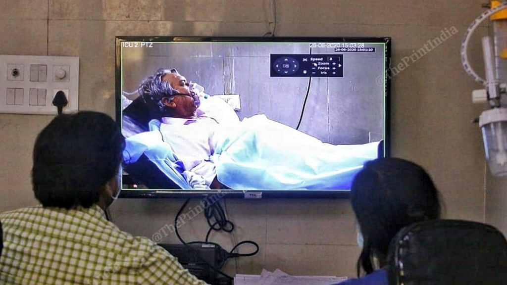 Doctors monitor a Covid-19 patient in the ICU at Agra's SN Medical College Hospital via a video screen | Photo: Praveen Jain | ThePrint