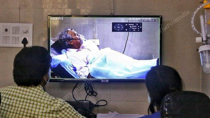 Doctors monitor a Covid-19 patient in the ICU at Agra's SN Medical College Hospital via a video screen | Photo: Praveen Jain | ThePrint