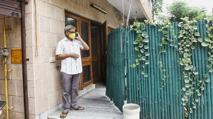 97-year-old G.C. Gupta's caretaker outside his residence in Agra