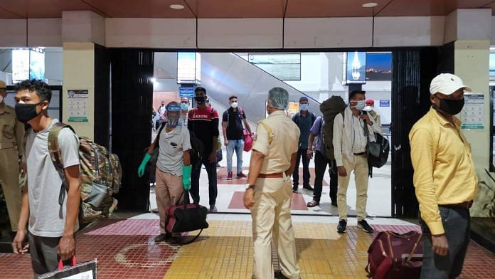 A policeman keeps vigil to maintain social distancing at the Guwahati railway station | Angana Chakrabarti | ThePrint