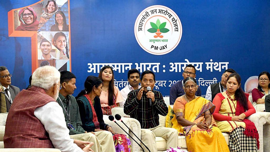 Representational image of PM Narendra Modi (far left) interacting with beneficiaries of Ayushman Bharat PM-JAY | Photo: ANI