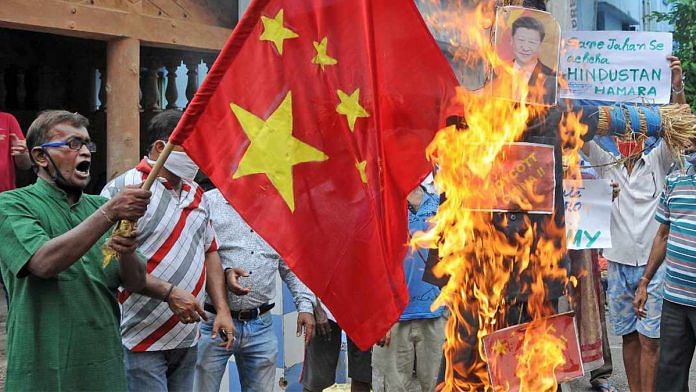 A Chinese flag and an effigy of President Xi Jinping are burnt during a protest against the Galwan Valley clash, in Kolkata | Representational image | ANI