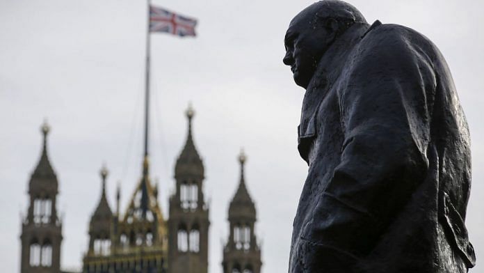 The statue of Winston Churchill near Houses of Parliament in London | Luke MacGregor/Bloomberg