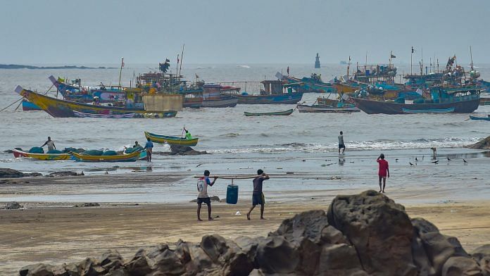 Fishing boats anchored at the shore as a precaution against Cyclone Nisarga, at Uttan beach in Thane on Monday