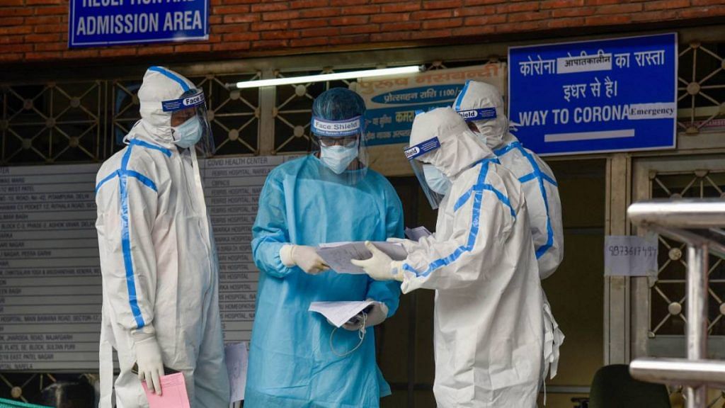 Health workers in protective suits at LNJP Hospital in New Delhi on 15 June 2020 | Manvender Vashist | PTI