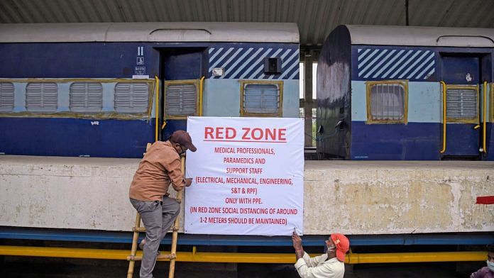 Workers converting a railway coach into an isolation ward at Shakurbasti railway station in Delhi | Photo: ANI