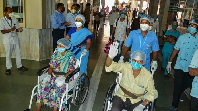 Medics and hospital staff applaud as patients who recovered from Covid-19 prepare to leave Krishna Hospital in Karad, Maharashtra, on 10 June 2020 | PTI