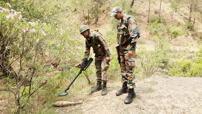 Indian security personnel with a mortar shell fired by Pakistan in Rajouri district of Jammu and Kashmir | Photo: ANI