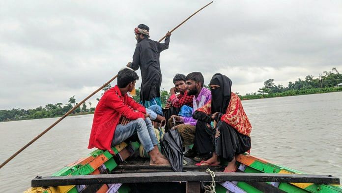 Residents of a remote area of Dhubri, a district in Assam, travel on boats to reach their houses. The flooded areas through which the boats traverse are paddy fields | Yimkumla Longkumer | ThePrint