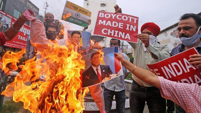 Traders of Janpath market burn effigy as they protest against China after the killing of Indian Soldiers at LAC, in Lucknow on 18 June 2020