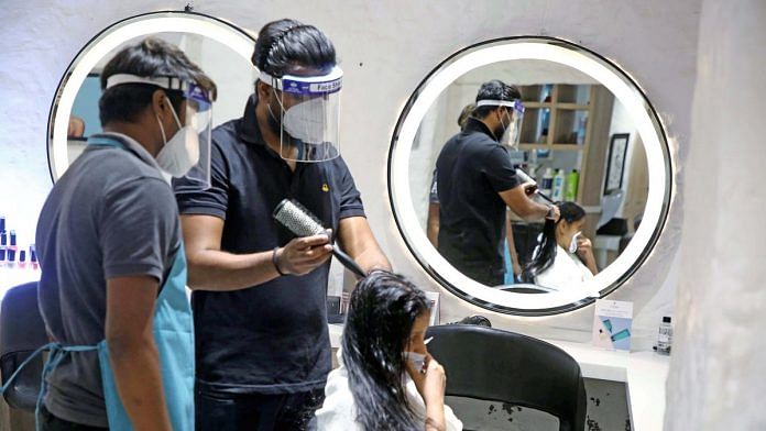 Salon workers don face shields to serve a customer in the 'Unlock 1' phase of the Covid-19 lockdown | Photo: ANI