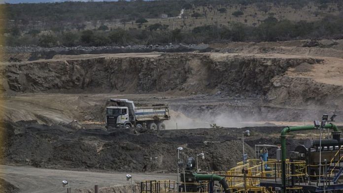 A truck drives through the open pit at the Lipari Mineracao Ltda. Brauna Diamond Mine in the Municipality of Nordestina, State of Bahia, Brazil | Photographer: Dado Galdieri | Bloomberg