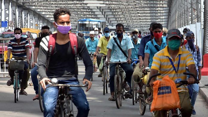 Workers cycle to their places of employment on Kolkata's Howrah Bridge (representational image) | Photo: ANI