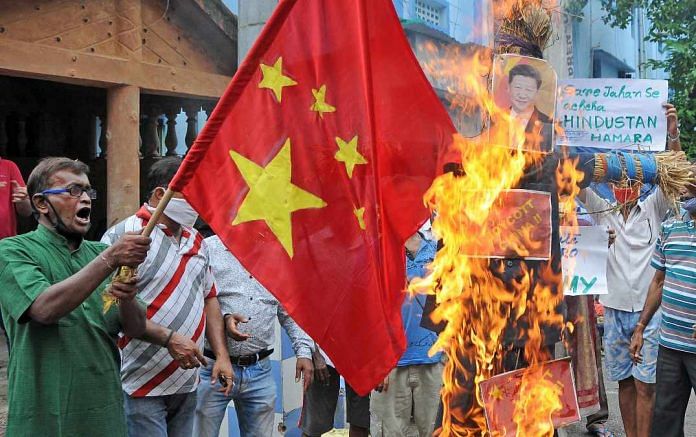 A Chinese flag and an effigy of President Xi Jinping are burnt during a protest against the Galwan Valley clash, in Kolkata Thursday | Representational image | ANI