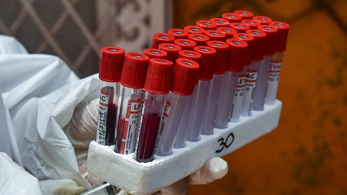 A medic takes blood samples for serological survey to analyse the spread of COVID-19, at Paharganj in New Delhi | PTI