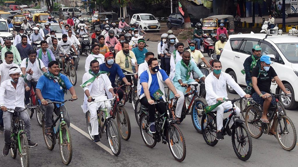 RJD leader Tejashwi Yadav along with Tej Pratap and party leaders ride bicycles as they stage a protest against increase in fuel prices, in Patna on 25 June 2020 (representational image) | ANI