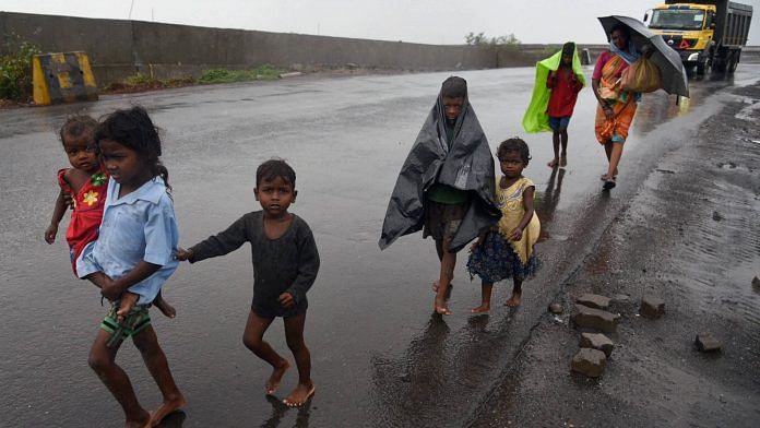 A family look for shelter during rainfall ahead of Cyclone Nisarga's expected landfall, in Navi Mumbai, Wednesday, June 3, 2020. | PTI