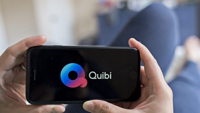 Signage for the Quibi short-form mobile video service is displayed on a smartphone