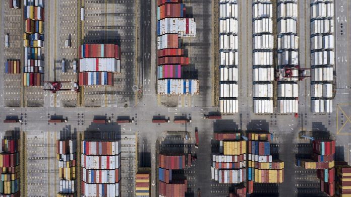 Shipping containers sit at the Yangshan Deepwater Port in Shanghai, China, on 23 March