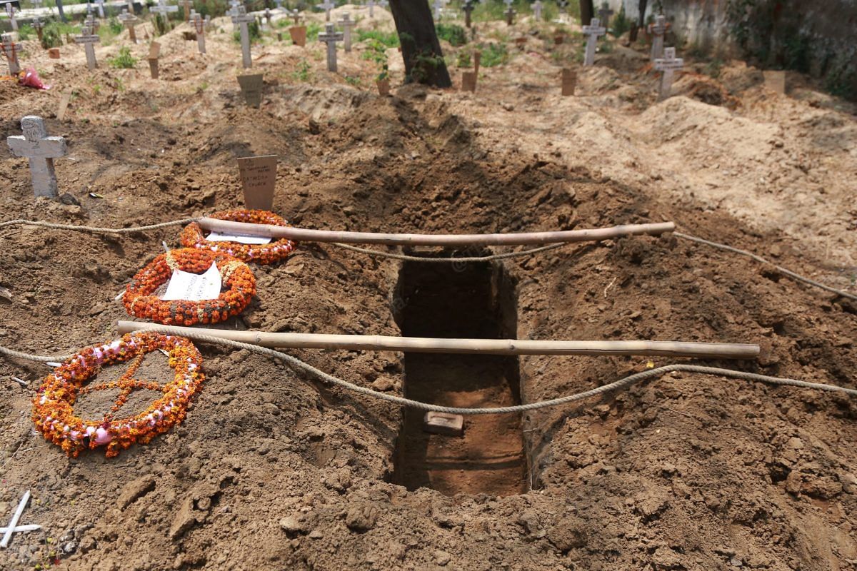 The burial ground was ready for the coffin before the arrival of the body at the Alpha Omega Christian Welfare Cemetery | Manisha Mondal | ThePrint