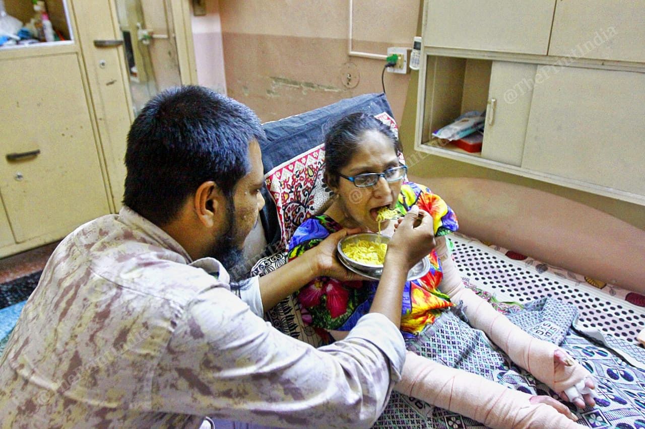 Faisal feeds Misbah, since she cannot use her hands | Praveen Jain | ThePrint
