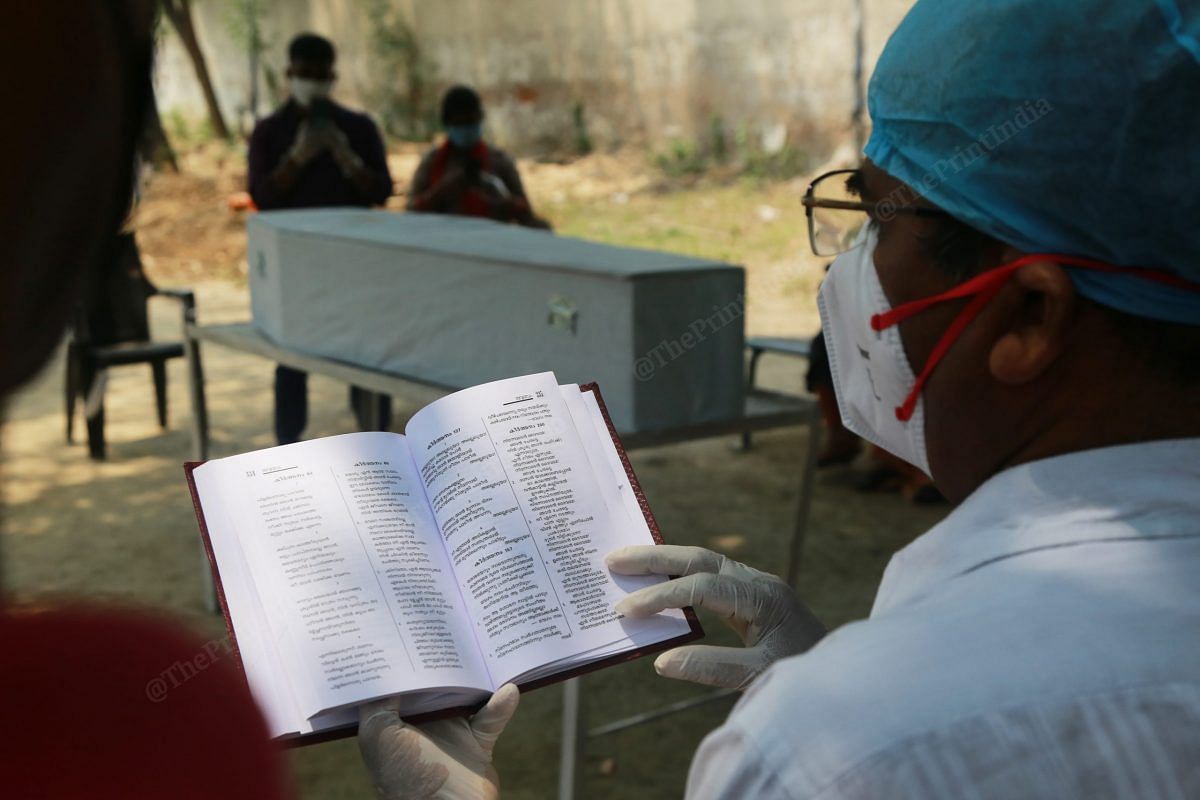 After the coffin with Shaji John's body was placed on a platform, a priest wearing a mask read from the Bible | Manisha Mondal | ThePrint