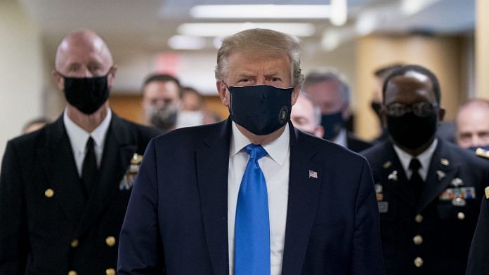 Donald Trump wears a mask while visiting Walter Reed National Military Medical Center in Bethesda, Maryland, on July 11. Chris Kleponis | Bloomberg