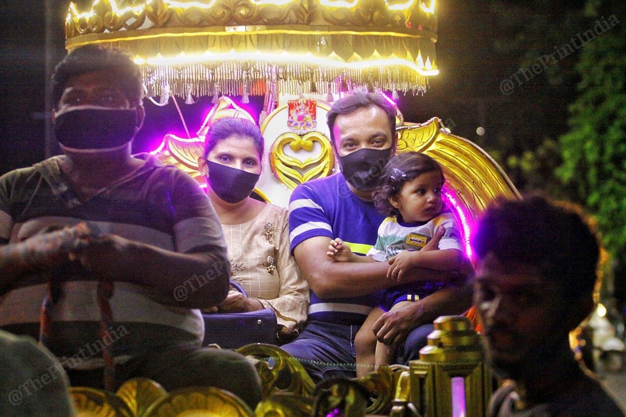 Families in Law Garden enjoy their ride on chariot. Law Garden in a famous play place for kids in Ahmedabad | Photo: Praveen Jain | ThePrint 