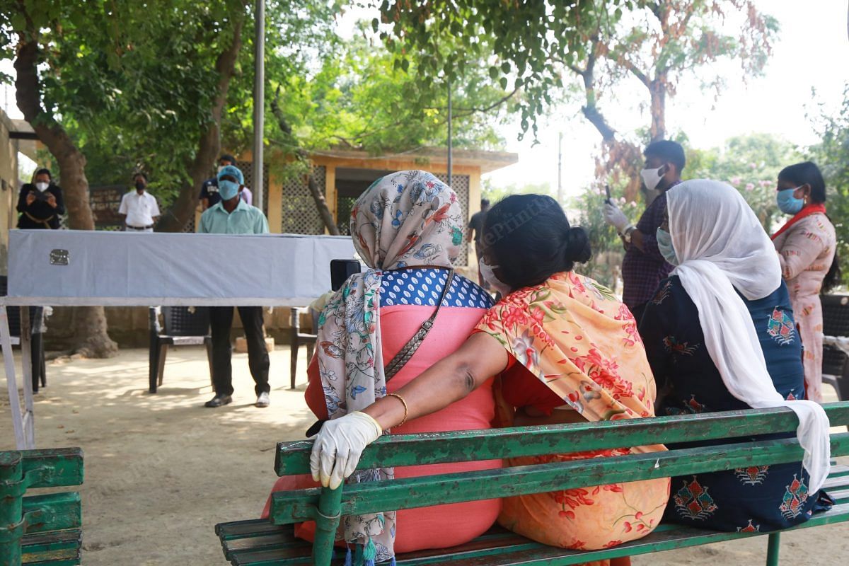 The heartbroken family looked on at the coffin where Shaji John's body was kept | Manisha Mondal | ThePrint